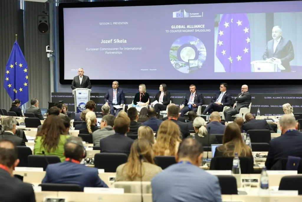 Jozef Síkela speaking at the podium during the second International Conference of the Global Alliance to Counter Migrant Smuggling in Brussels.